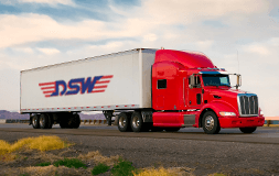 A Red Semi Truck with DSW Logo on the Side