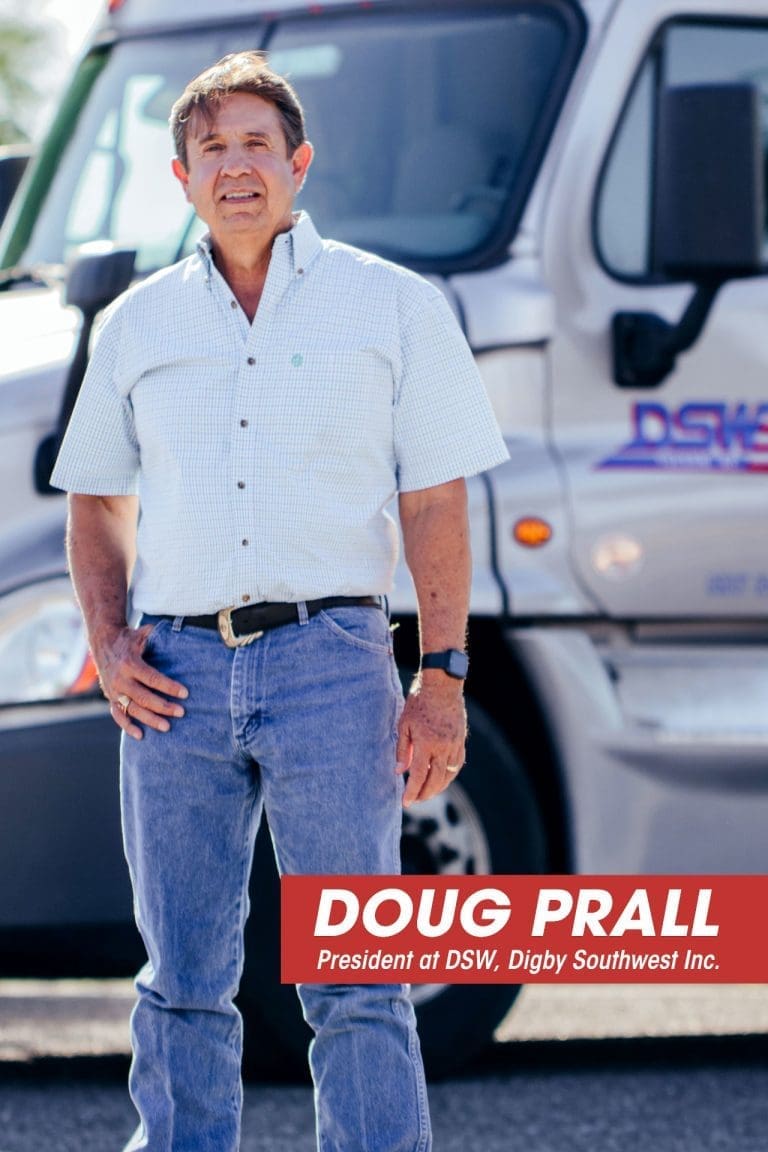 Doug Prall, president of our truck driving company, standing in front of a truck